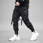 Front view of men’s ribbon harem cargo joggers with elastic waist and streetwear style