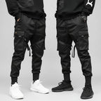 Front view of men’s ribbon harem cargo joggers with elastic waist and streetwear style